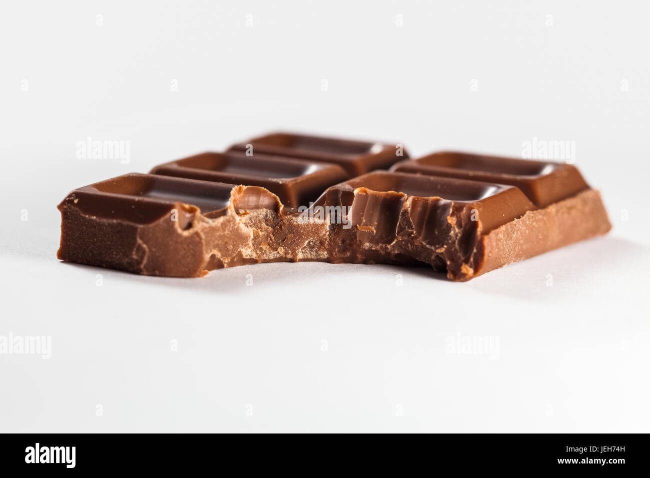 A piece of chocolate bar with a bite out of the corner; Ontario, Canada