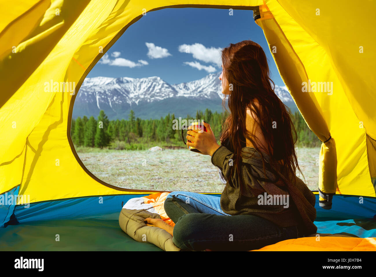 Young woman cup mountains tent Stock Photo