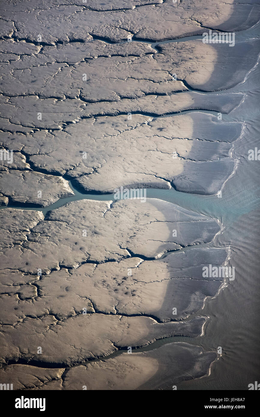 Aerial view of patterns made by water draining over the Silt Mud Flats ...