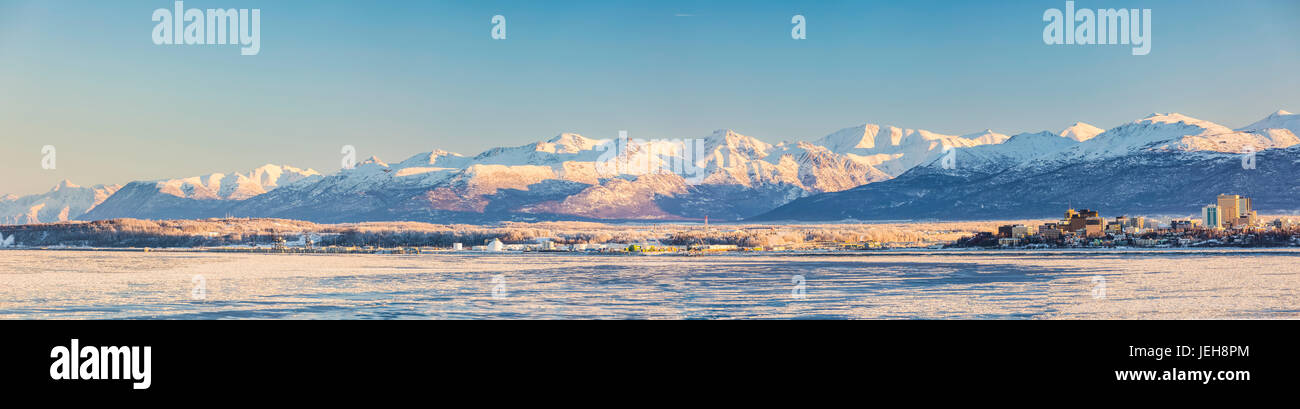 Panorama Of Downtown Anchorage And The Port Of Anchorage In Winter, Snow Capped Chugach Mountains In The Background, Seen From Point Mackenzie, The... Stock Photo