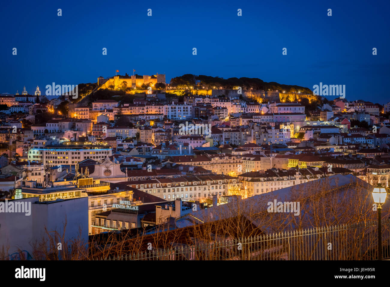 View of the city of Lisbon from Miradouro de Sao Pedro de Alcantara at night; Lisbon, Portugal Stock Photo