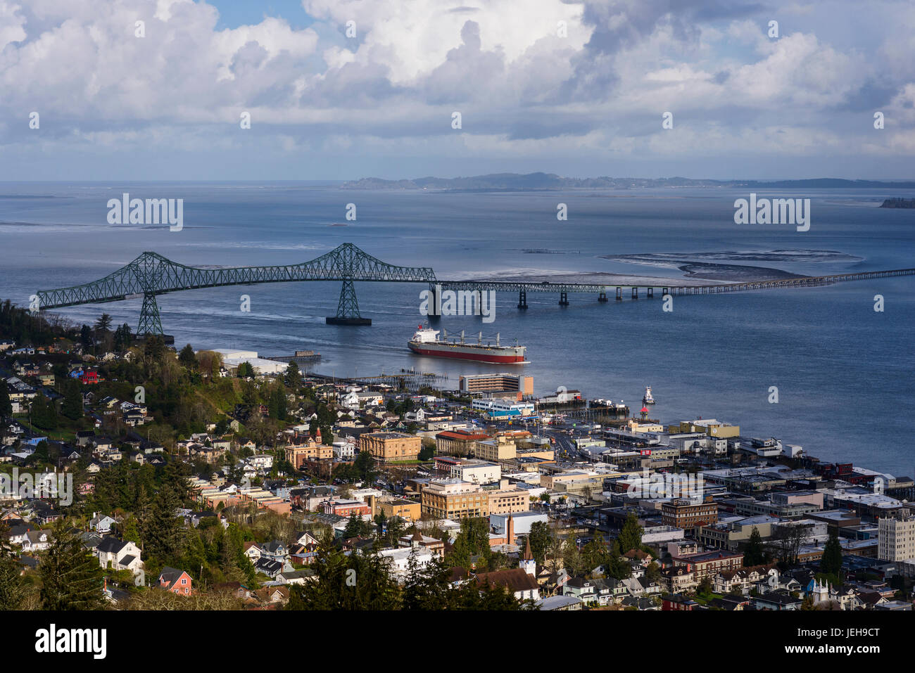 A ship passes the Astoria waterfront; Astoria, Oregon, United States of