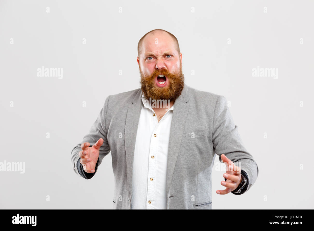 Angry, dissatisfied man with beard Stock Photo