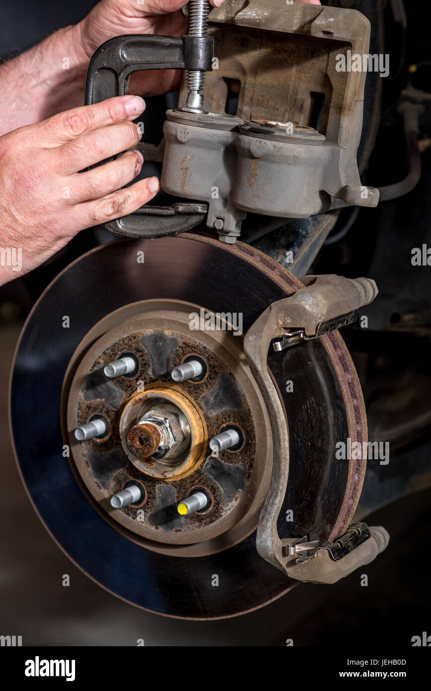 Compressing truck brakes using a cclamp Stock Photo Alamy