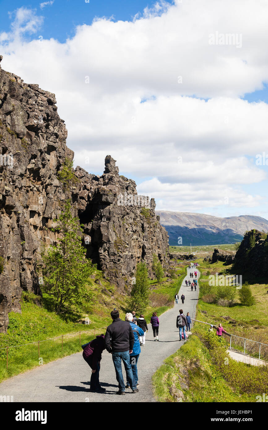 Tourists walking between the Eurasian and American tectonic plates along the mid-Atlantic Ridge in Iceland Stock Photo