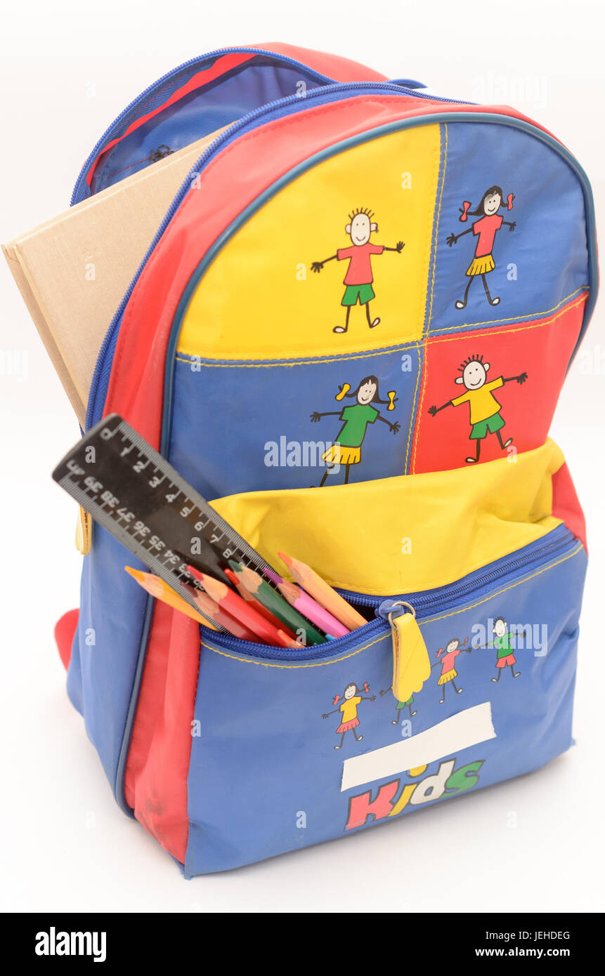 School backpack with accessories on a light background. Stock Photo