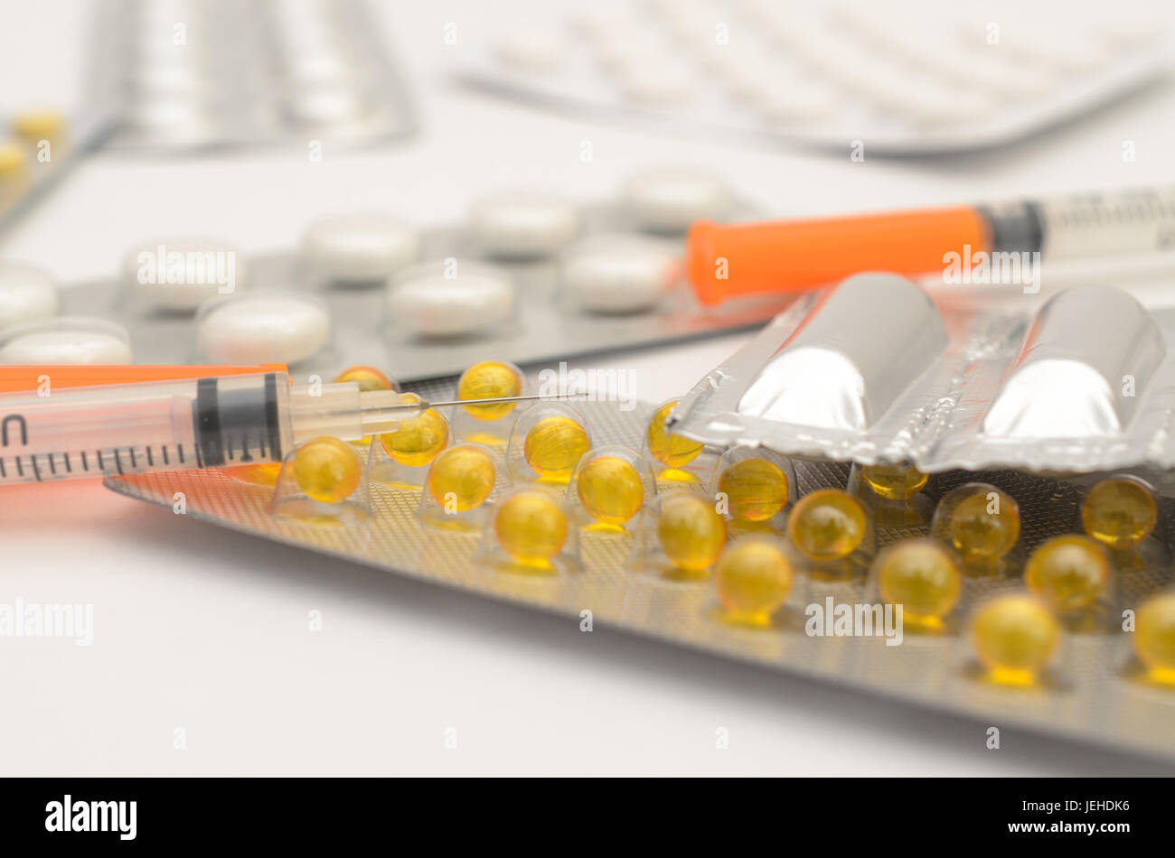 Contraceptive tablets in packages and without on a light background. Stock Photo