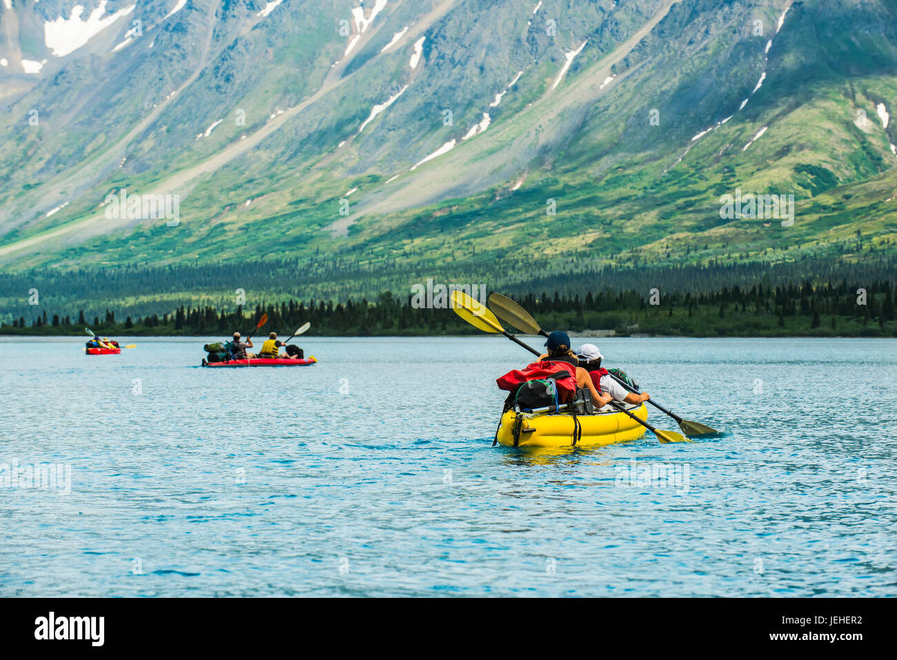 Group kayaking across Twin Lake in Lake Clark National Park and Preserve, Southcentral Alaska, USA Stock Photo