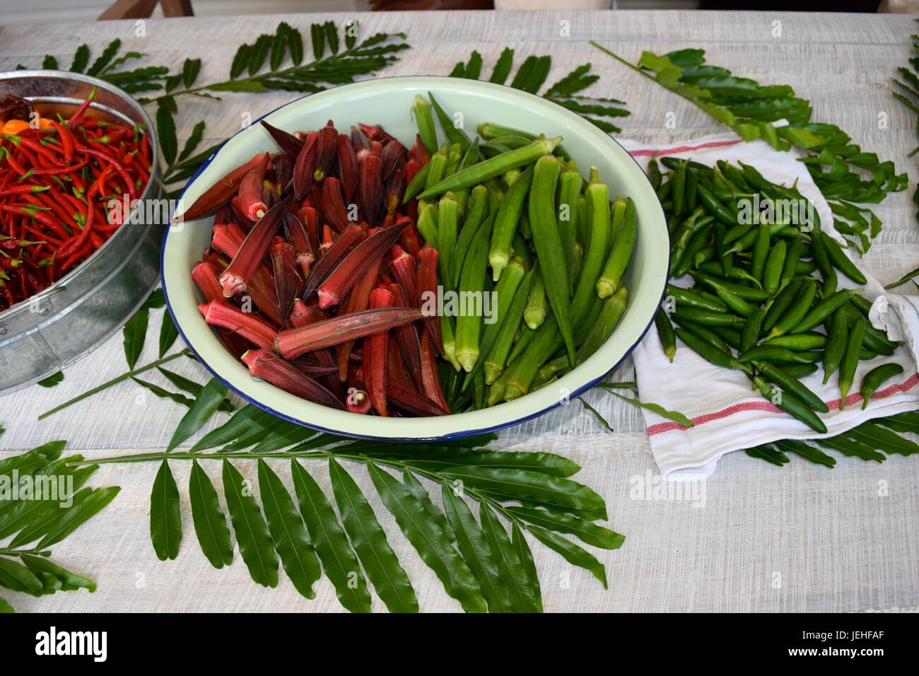 Fresh Okra aka Gumbo and chili peppers Stock Photo Alamy