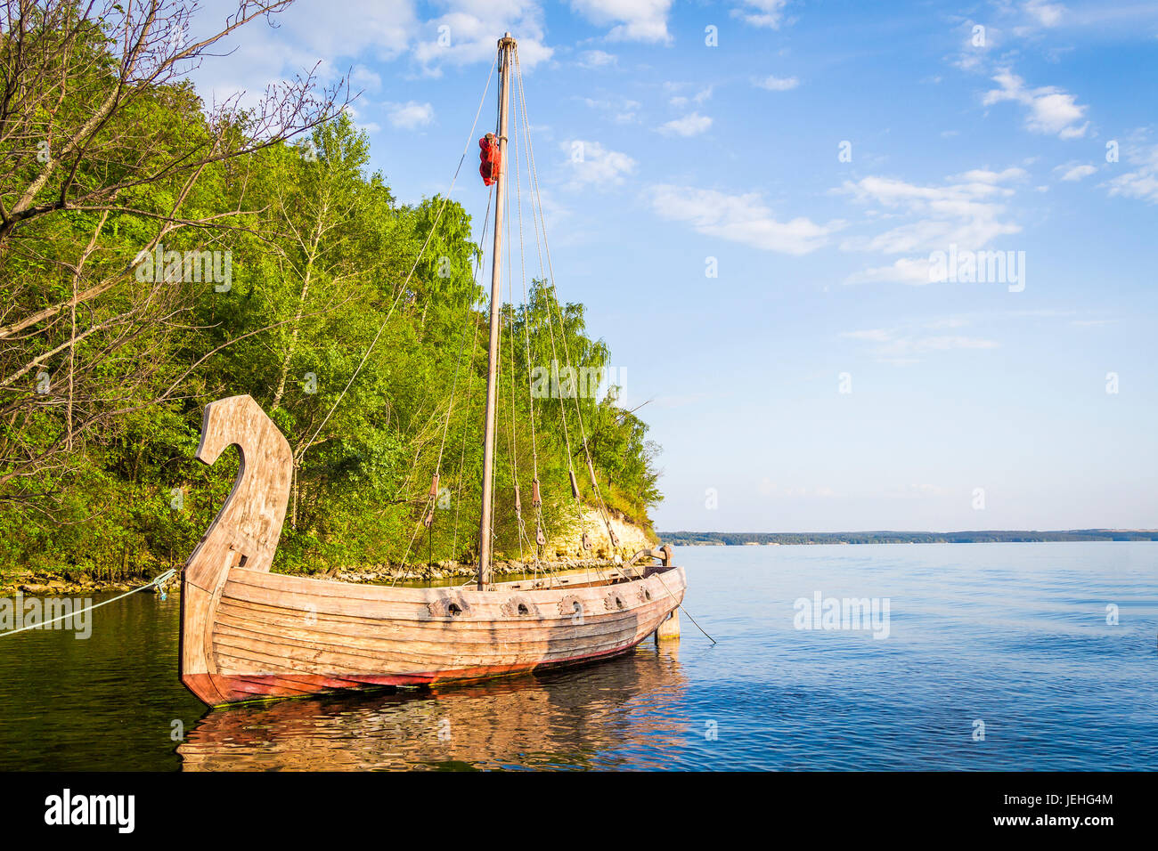 Ancient wooden ship is in a bay near the pier Stock Photo - Alamy