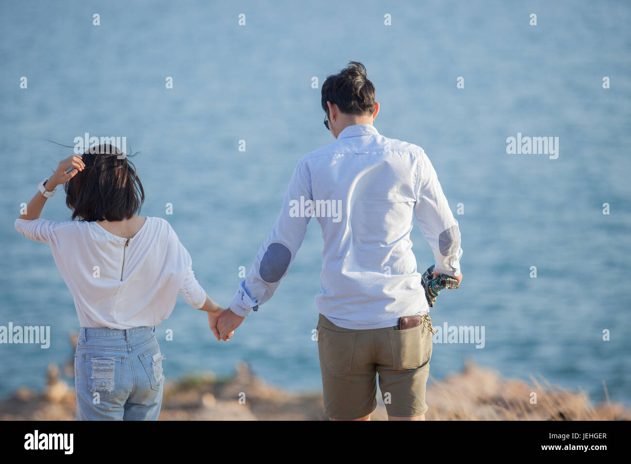couples of younger man and woman in love relaxing vacation outdoor lifestyle Stock Photo