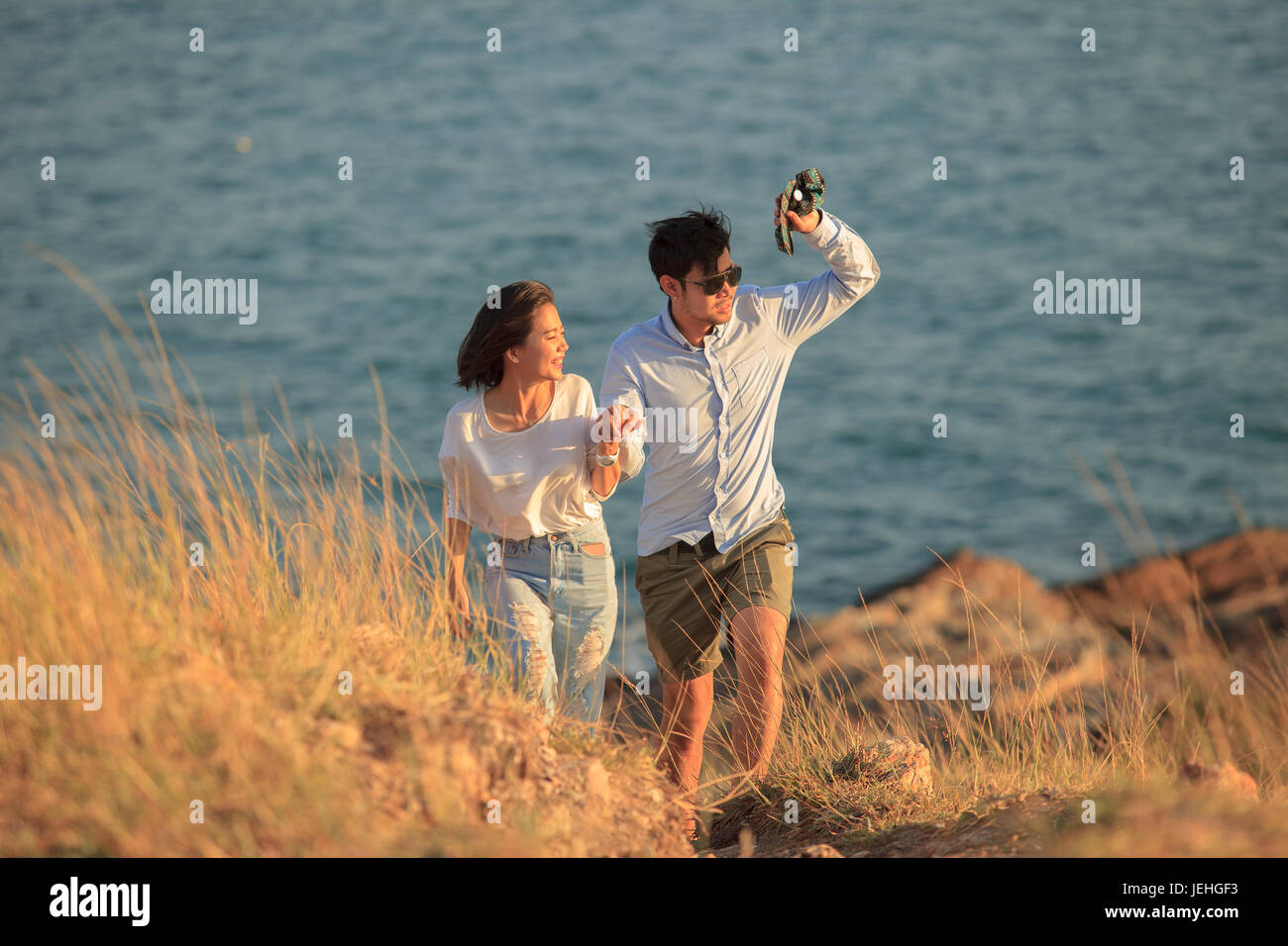 couples of younger man and woman in love relaxing vacation outdoor lifestyle Stock Photo