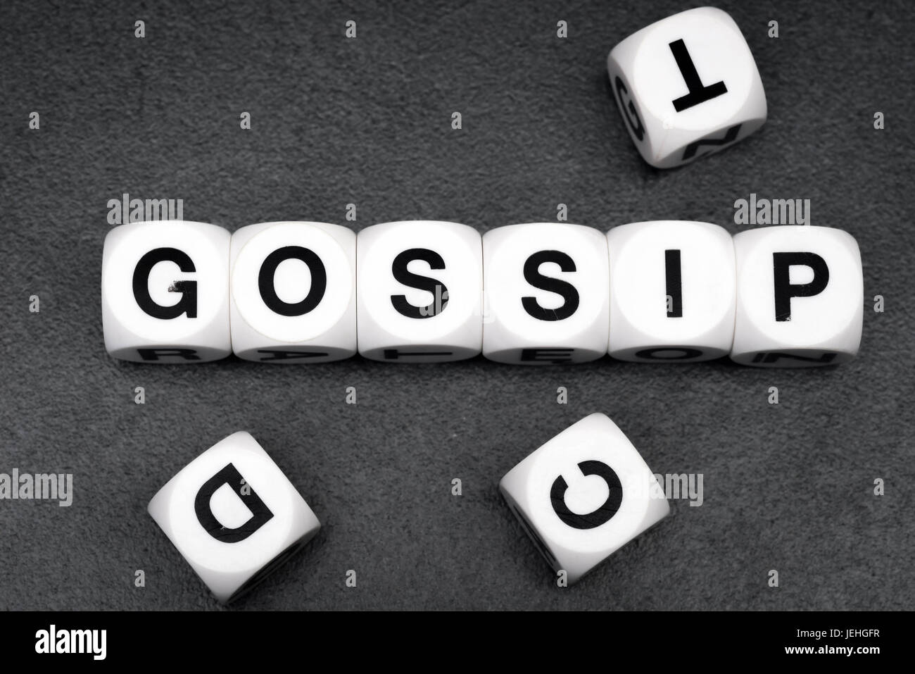 word gossip on white toy cubes Stock Photo