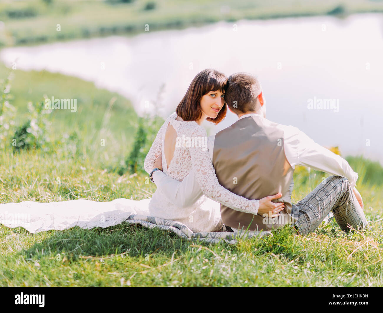 Back view newlyweds sitting hi-res stock photography and images - Alamy