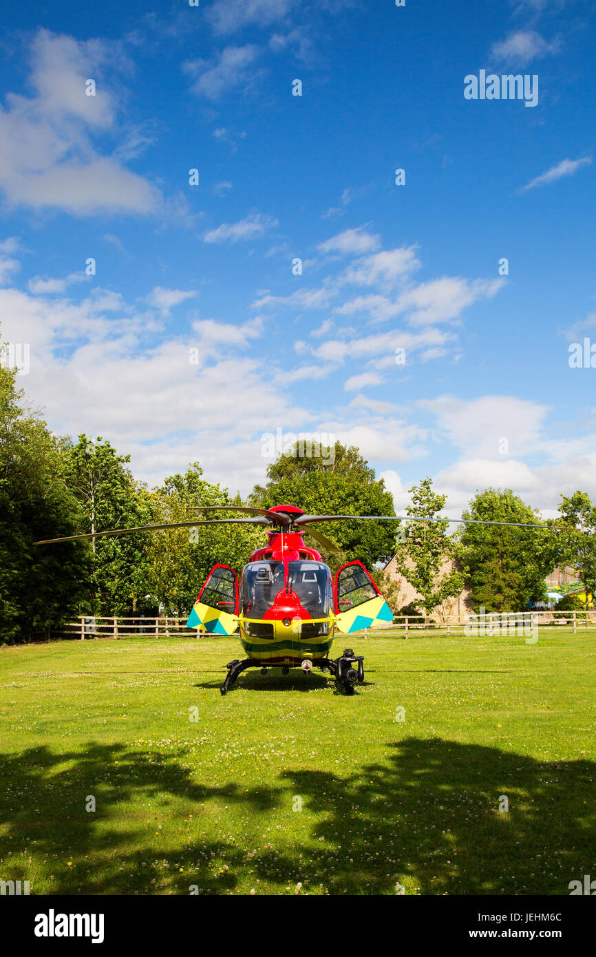The Thames Valley Air Ambulance lands in an Oxfordshire field prior to transport a seriously ill casualty to hospital. Stock Photo