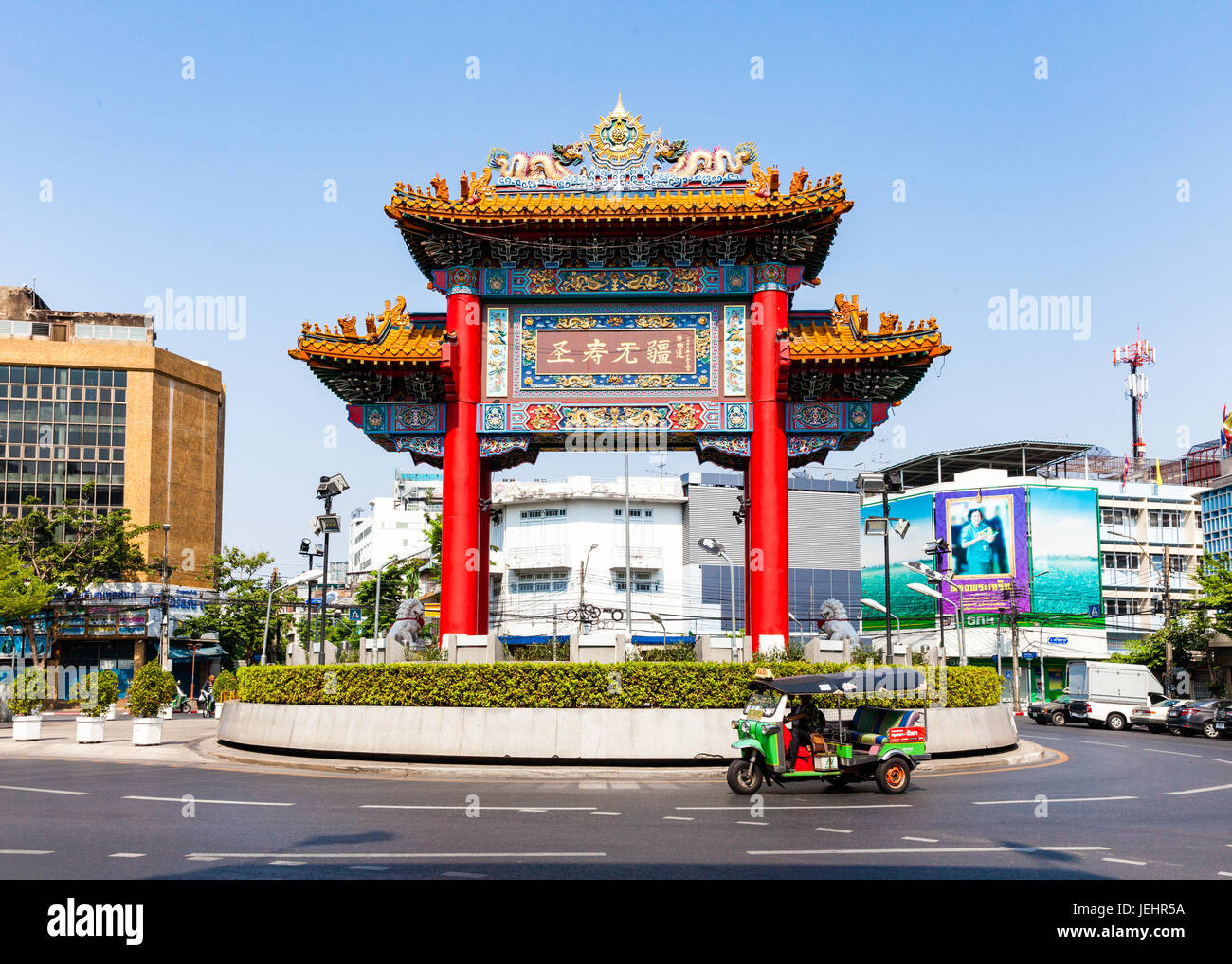 BANGKOK, THAILAND - APRIL 24: Traditional Thai taxi with Chinatown Gate on background on April 24, 2016 in Bangkok, Thailand. Stock Photo