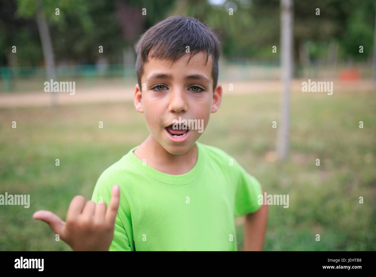 Green eyes boy smiling the park Stock Photo - Alamy