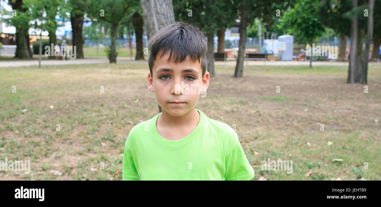 Green eyes boy smiling the park Stock Photo - Alamy