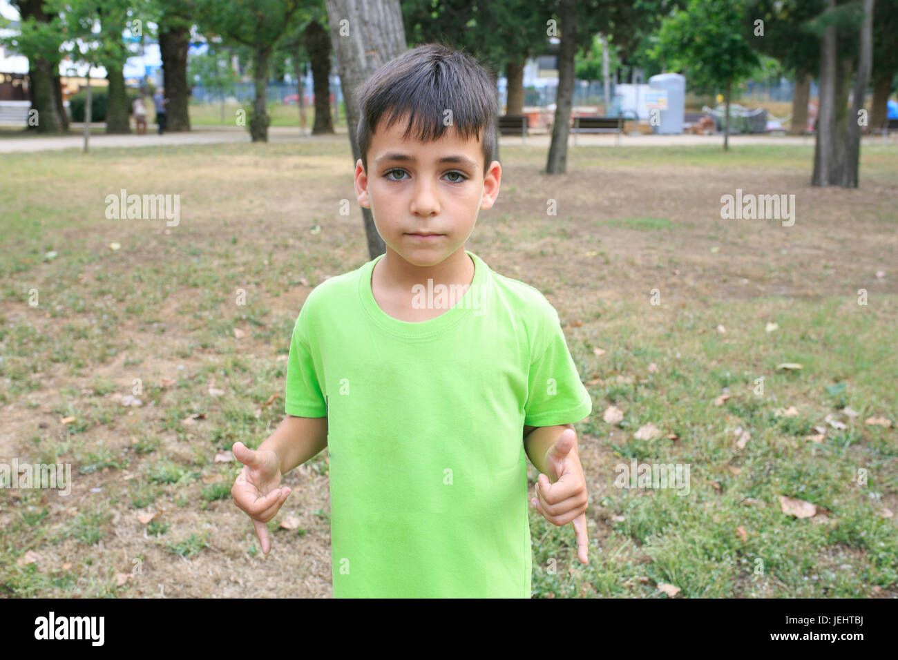 Green eyes boy smiling the park Stock Photo - Alamy