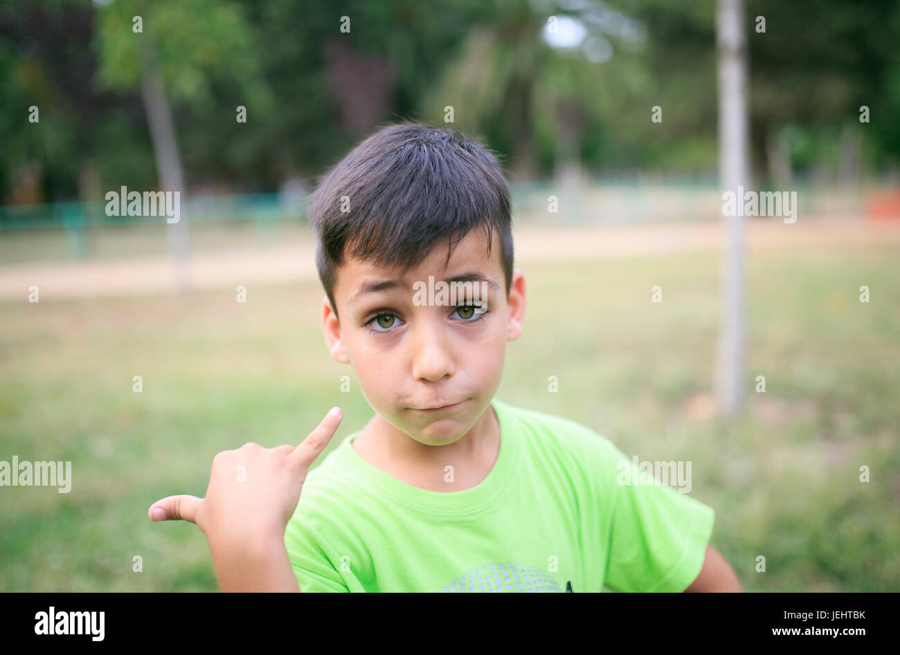 Green eyes boy smiling the park Stock Photo - Alamy