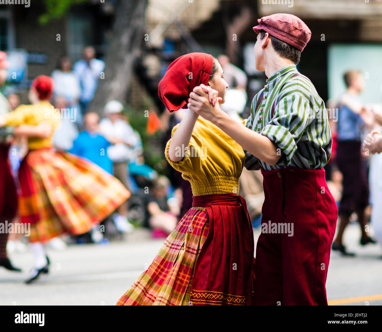 Folk Dancers in the Quebec Day Parade on Saint-Denis Street in Montreal Stock Photo