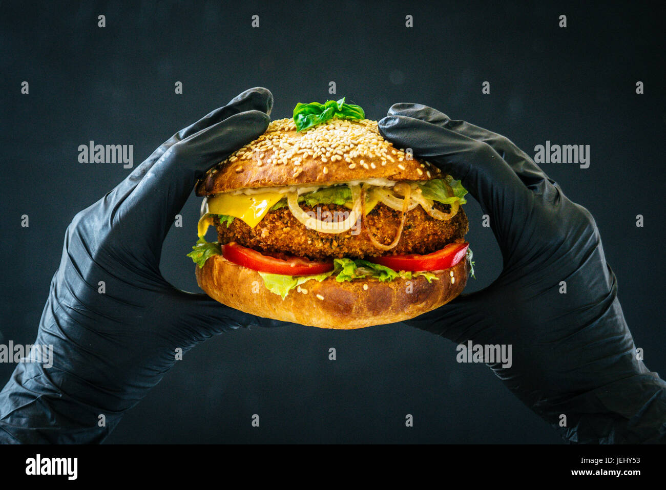 Hands holding big hamburger hi-res stock photography and images - Alamy