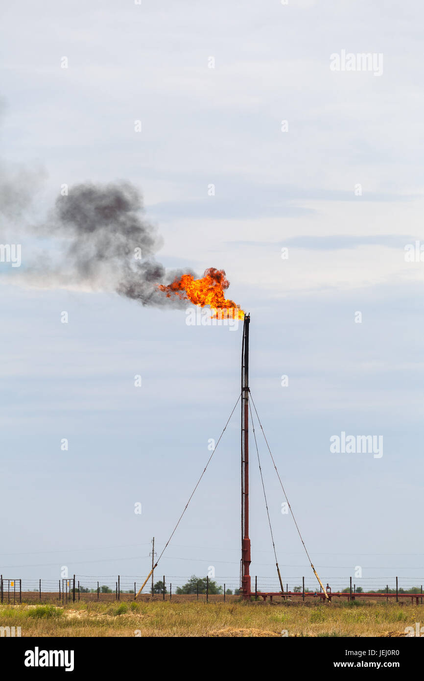Flaring of associated gas at oil refinery Stock Photo