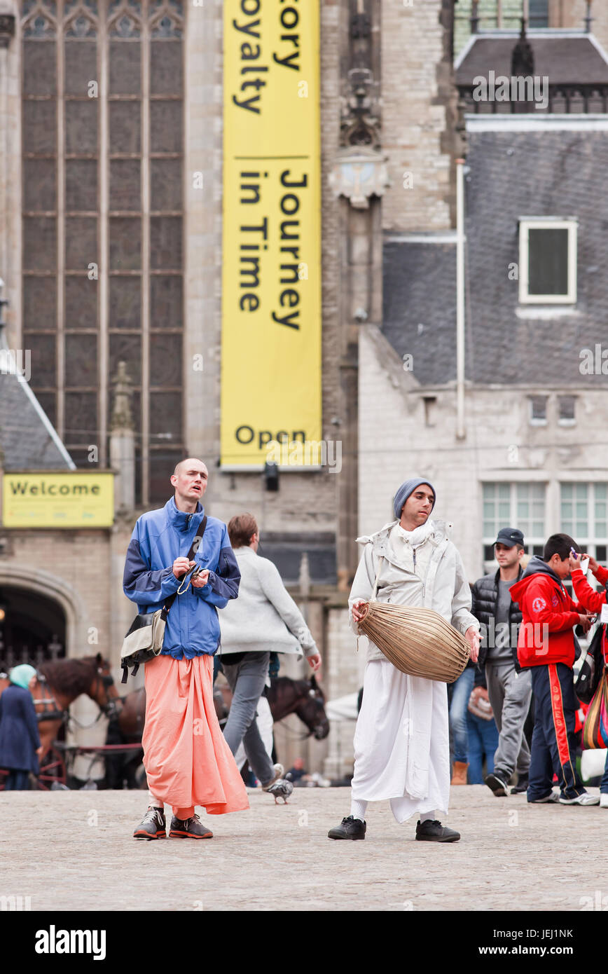 AMSTERDAM-AUGUST 26, 2014. Hare Krishnas at the Dam Square. Hare Krishna is a religious movement based on traditional Hindu scriptures Stock Photo