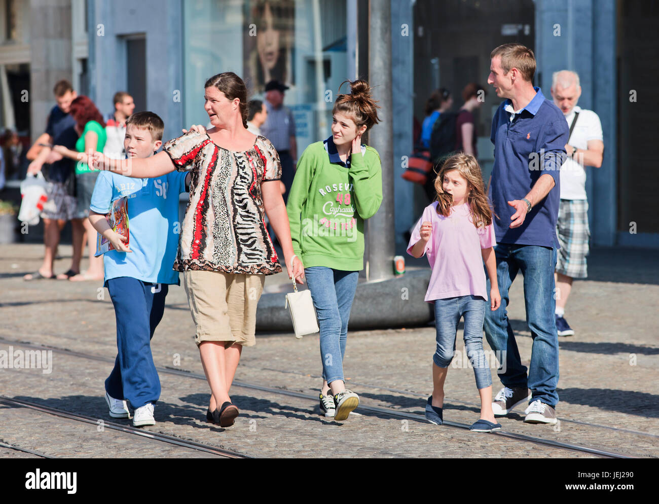 AMSTERDAM-AUG. 20, 2012. Family have fun walking around in Amsterdam. With 12,7 million tourists, The Netherlands had a record number of visitors. Stock Photo
