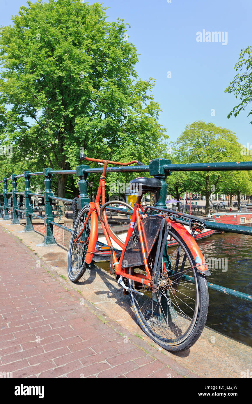 Bicycles outnumber people in Amsterdam: 760,000 citizens and nearly a million bikes. There are also twice as many bikes then cars. Stock Photo