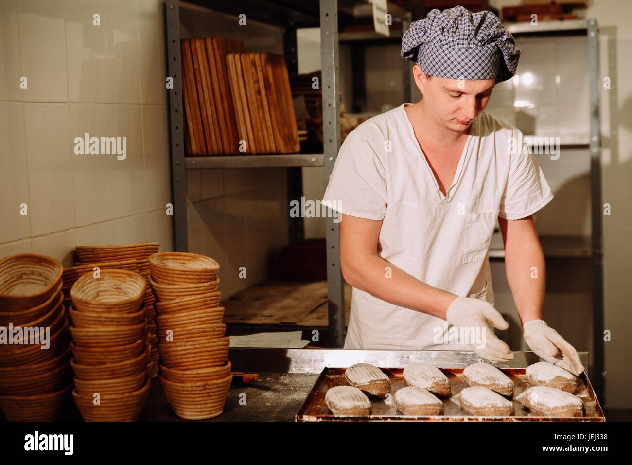 Proving dough of bran in basket. Private Bakery. Production bread Stock ...