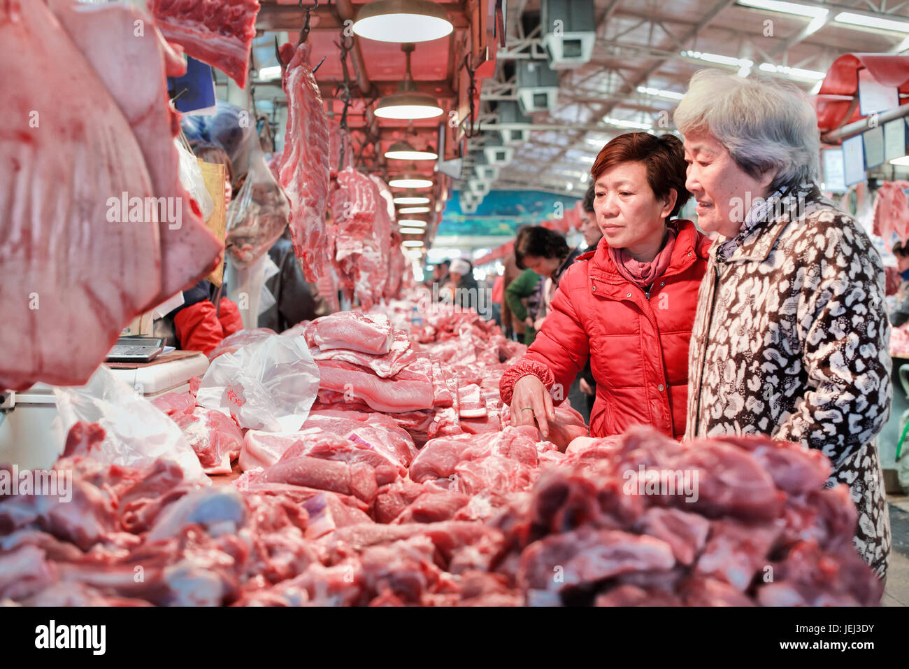 BEIJING-MARCH 14. Dongjiao indoor meat market. There are still many traditional indoor markets in many Chinese cities. Stock Photo