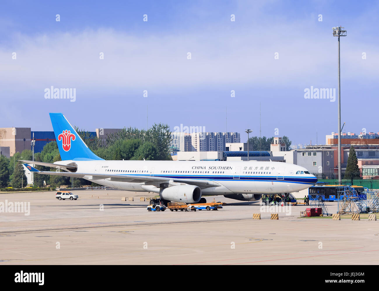 BEIJING-JULY 15, 2016. B-6058 China Southern Airlines Airbus A330-243 parked at Beijing Capital International Airport on a sunny day. Stock Photo