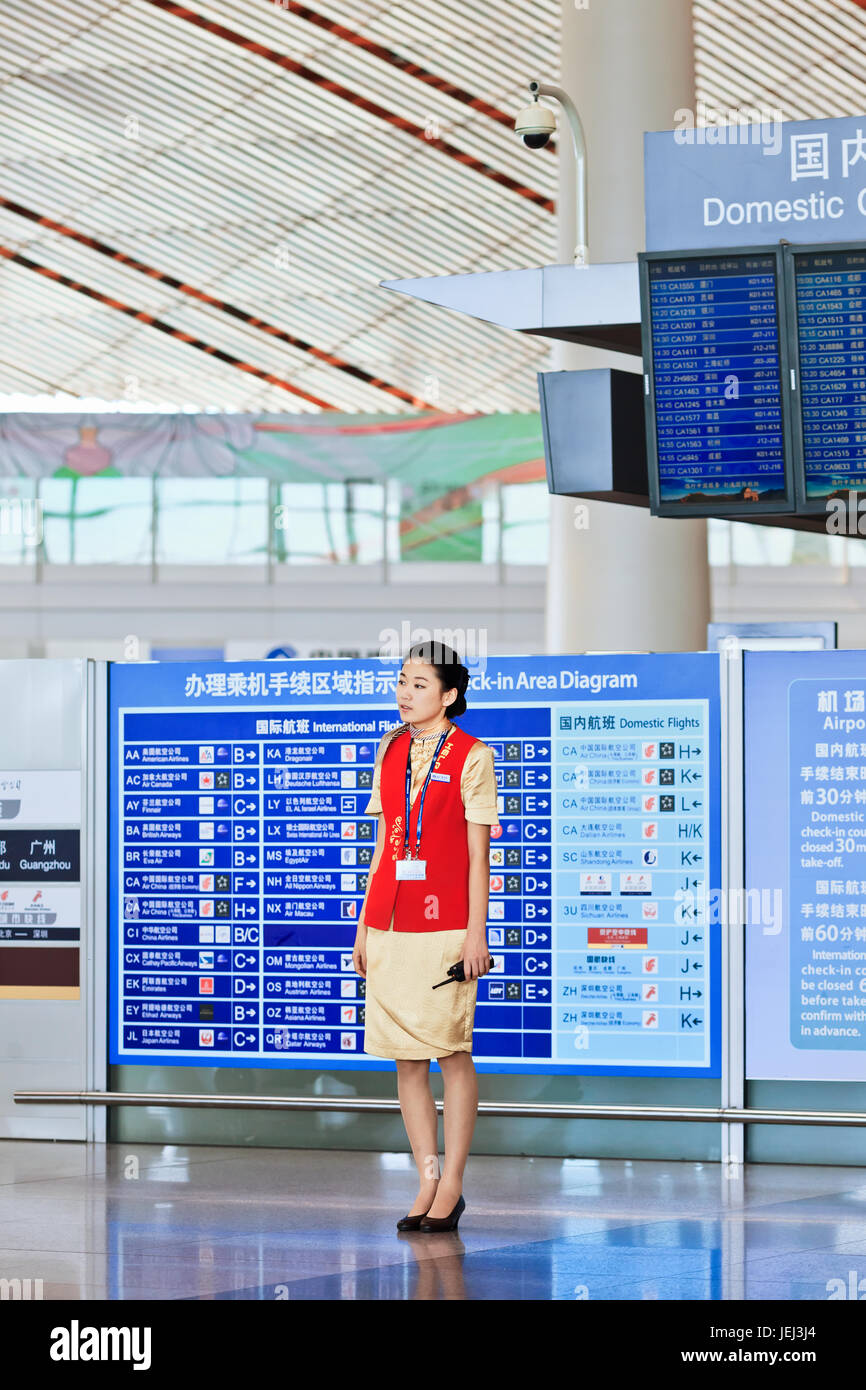BEIJING-SEPT. 3, 2012. Hostesses at Beijing Capital Airport Terminal 3 on Sept. 3, 2012. It is the main hub for Air China, the flag carrier of China. Stock Photo