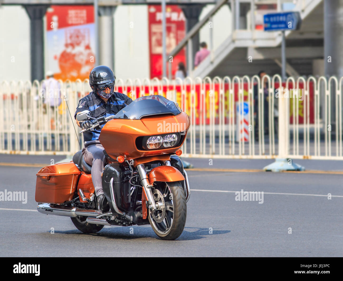 BEIJING-APRIL 28, 2016. Orange Harley Davidson Road Glide. New designed hardcore touring motorcycle with an aerodynamic shark-nose, new twin Cam 96. Stock Photo