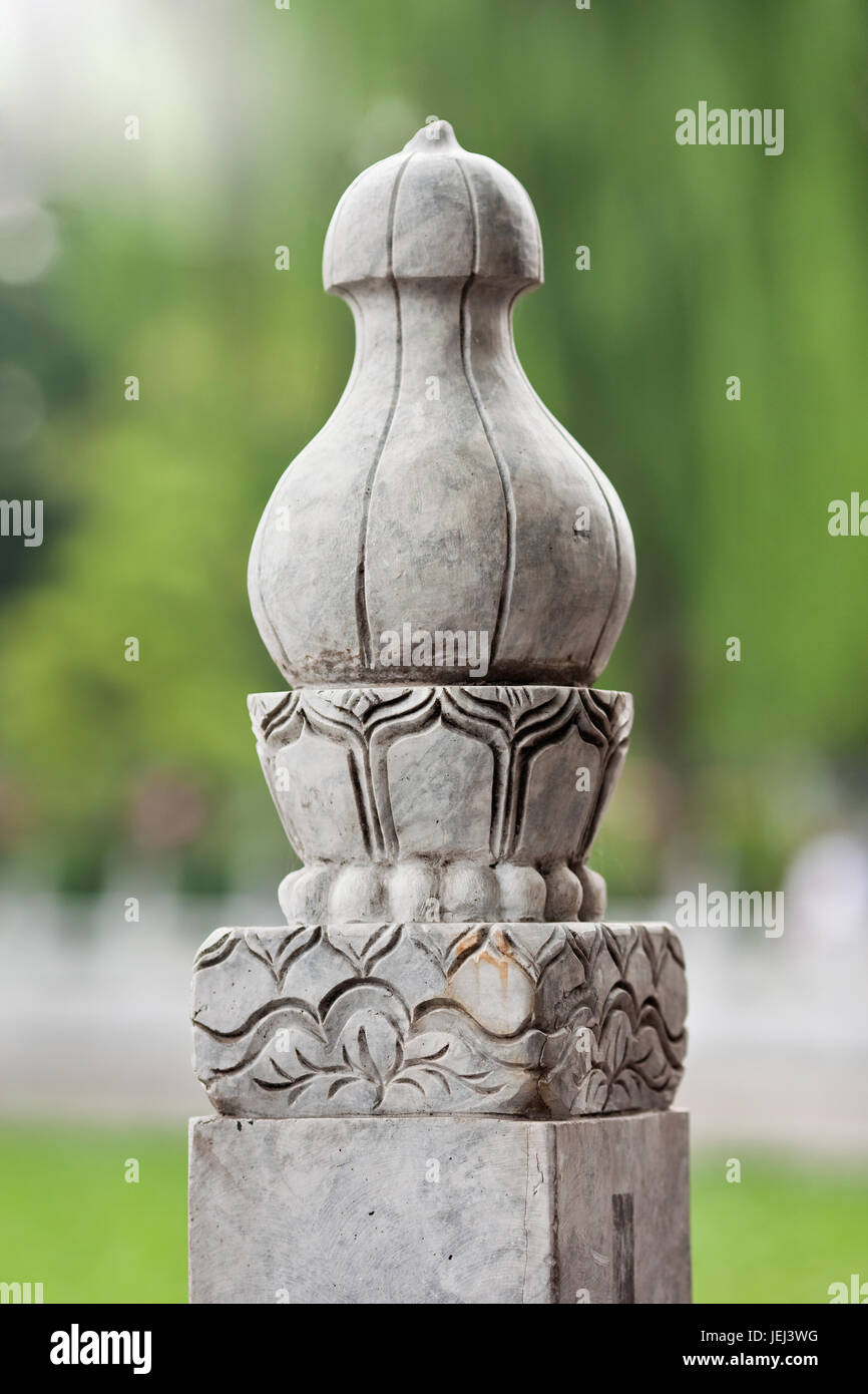 Close up of a part of a stone balustrade around a lake Stock Photo