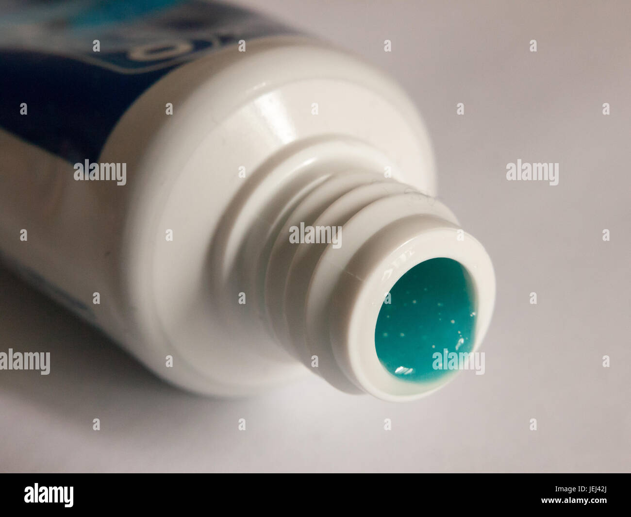 close up opened bottle tube of blue toothpaste Stock Photo Alamy