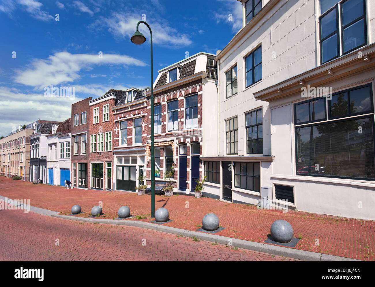 Street with row of renovated houses with green lantern, Gouda, The