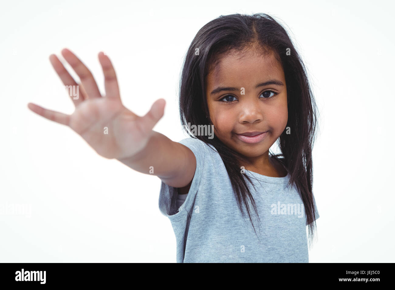 Smiling girl holding hand to the camera Stock Photo - Alamy
