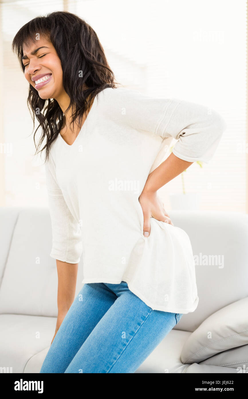 Pretty woman with back pain Stock Photo