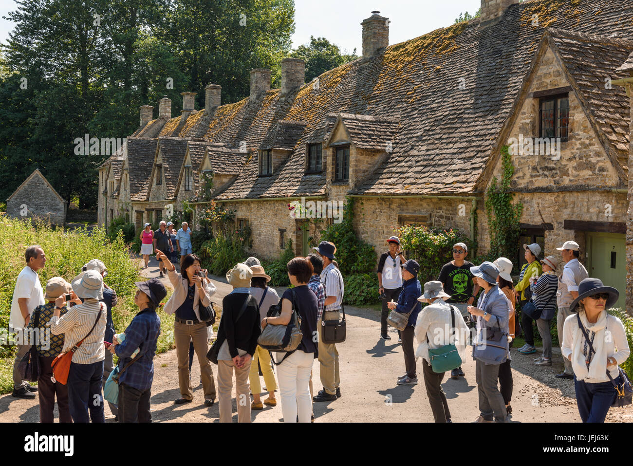 Hordes of tourists at Arlington Row, Bibury, Cotswolds, UK Stock Photo