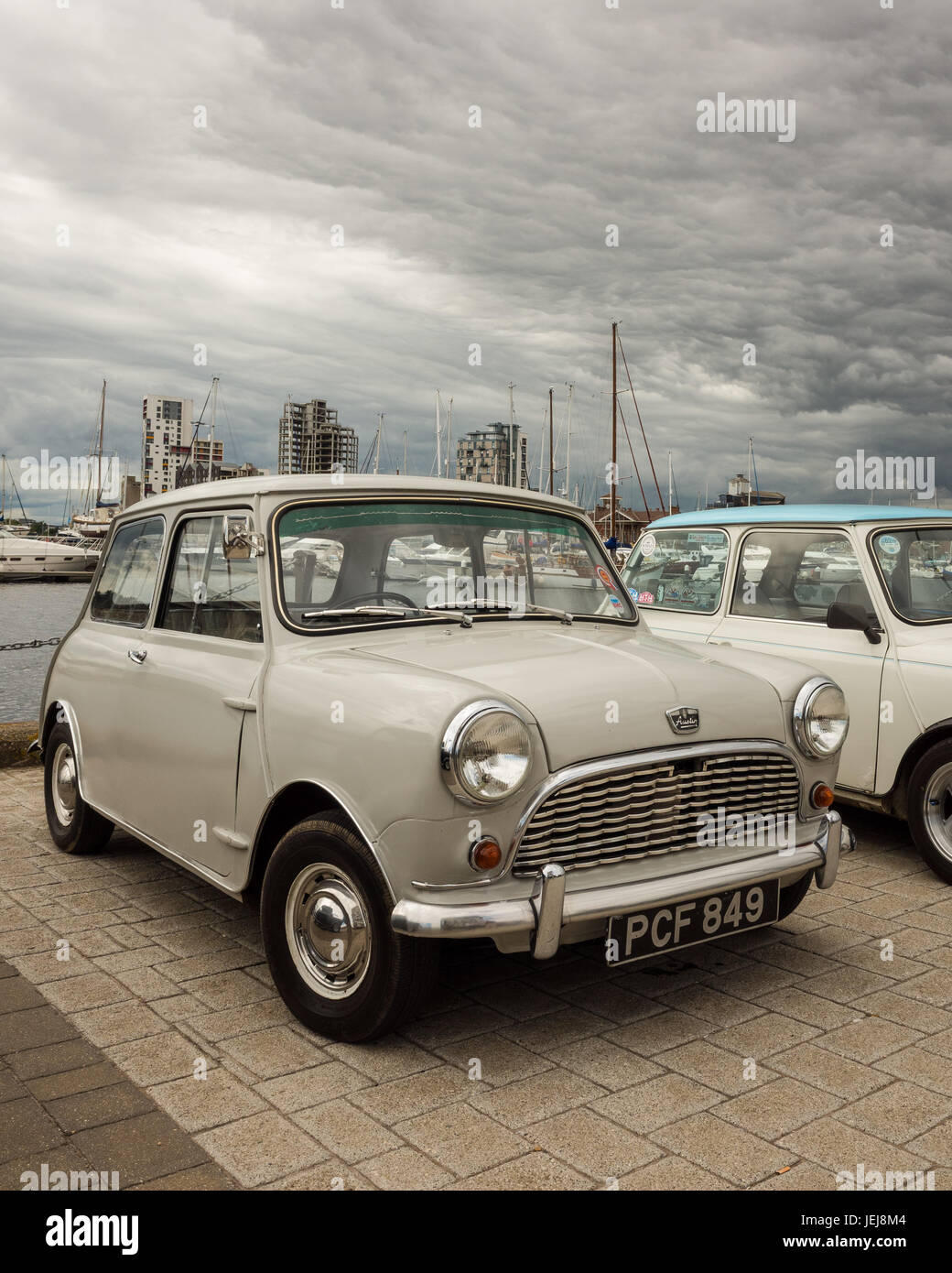 Waterfront Quay, Ipswich. England UK. 25th June, 2017. A large number of classic mini cars gathered on Ipswich Waterfront Quay following a treasure hunt organised by the Ipswich & Suffolk Mini Owners Club, ISMOC.  Other mini clubs across the region including Colchester and Bury St Edmunds joined this event to celebrate this iconic car. This  mini  came  off  the   assembly  line  on  21st June  196o.  it  is  an  Austin Mini  Delux  as  it  is  fitted  with  a  heater  the  standard  model  did  not  have  one.  The  engine  is  848cc  and  is  standard  fitted  with  new  bearings  and has a  Stock Photo