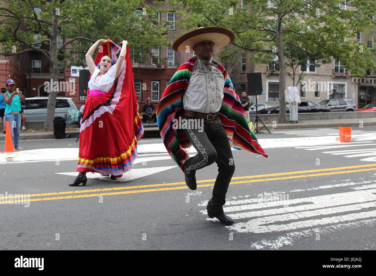 New York, USA. 25th June, 2017. The Mexican dance group 'Mazarte' performs for the public at the Boogie on the Boulevard event on the Grand Concord Boulevard in the Bronx. The center lanes of the normally busy Grand Concourse roadway from 162nd Street to 170th Street is closed to cars and open to a world of fun with free music, art and fitness programs hosted by organizations from the Bronx and beyond . Credit:  G. Ronald Lopez /DigiPixsAgain.us/Alamy Live News Stock Photo