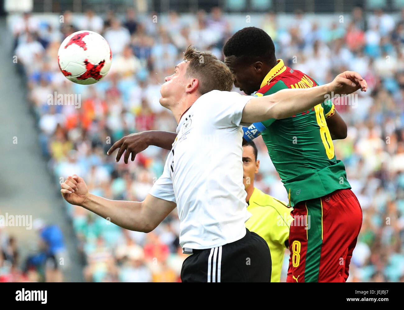 Sochi, Russia. 25th June, 2017. Matthias Ginter (L) of Germany heads the ball with Benjamin Moukandjo of Cameroon during the group B match between Germany and Cameroon of the 2017 FIFA Confederations Cup in Sochi, Russia, on June 25, 2017. Germany won 3-1. Credit: Xu Zijian/Xinhua/Alamy Live News Stock Photo
