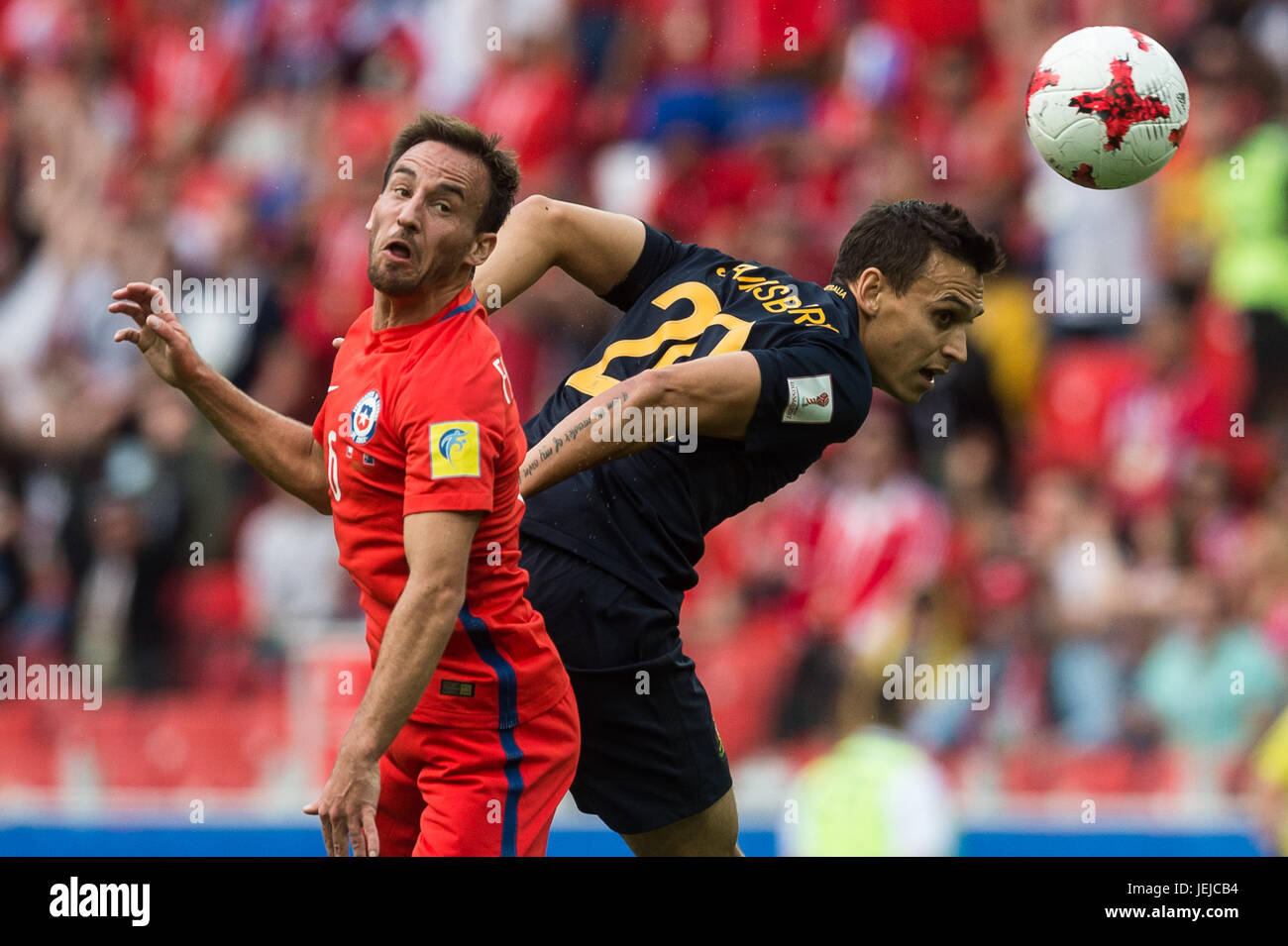 Moscow, Russia. 25th June, 2017. Jose Fuenzalida (L) of Chile vies for the ball with Trent Sainsbury of Australia during the FIFA Confederations Cup 2017 football match in Moscow, Russia, June 25, 2017. Match ended 1-1. Credit: Evgeny Sinitsyn/Xinhua/Alamy Live News Stock Photo