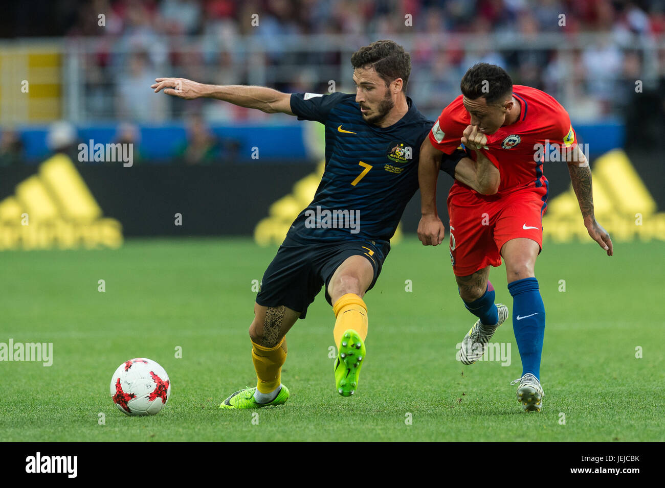 Moscow, Russia. 25th June, 2017. Mathew Leckie (L) of Australia vies for the ball with Jose Fuenzalida of Chile during the FIFA Confederations Cup 2017 football match in Moscow, Russia, June 25, 2017. Match ended 1-1. Credit: Evgeny Sinitsyn/Xinhua/Alamy Live News Stock Photo