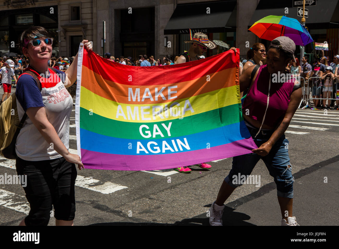 New York, USA. 25th June, 2017. New York City Heritage of Pride March filled Fifth Avenue for hours with groups from the LGBT community and it's supporters. Marchers carry a banner reading "Make America gay again," a dig at President Trump's campaign slogan. Credit: Ed Lefkowicz/Alamy Live News Stock Photo