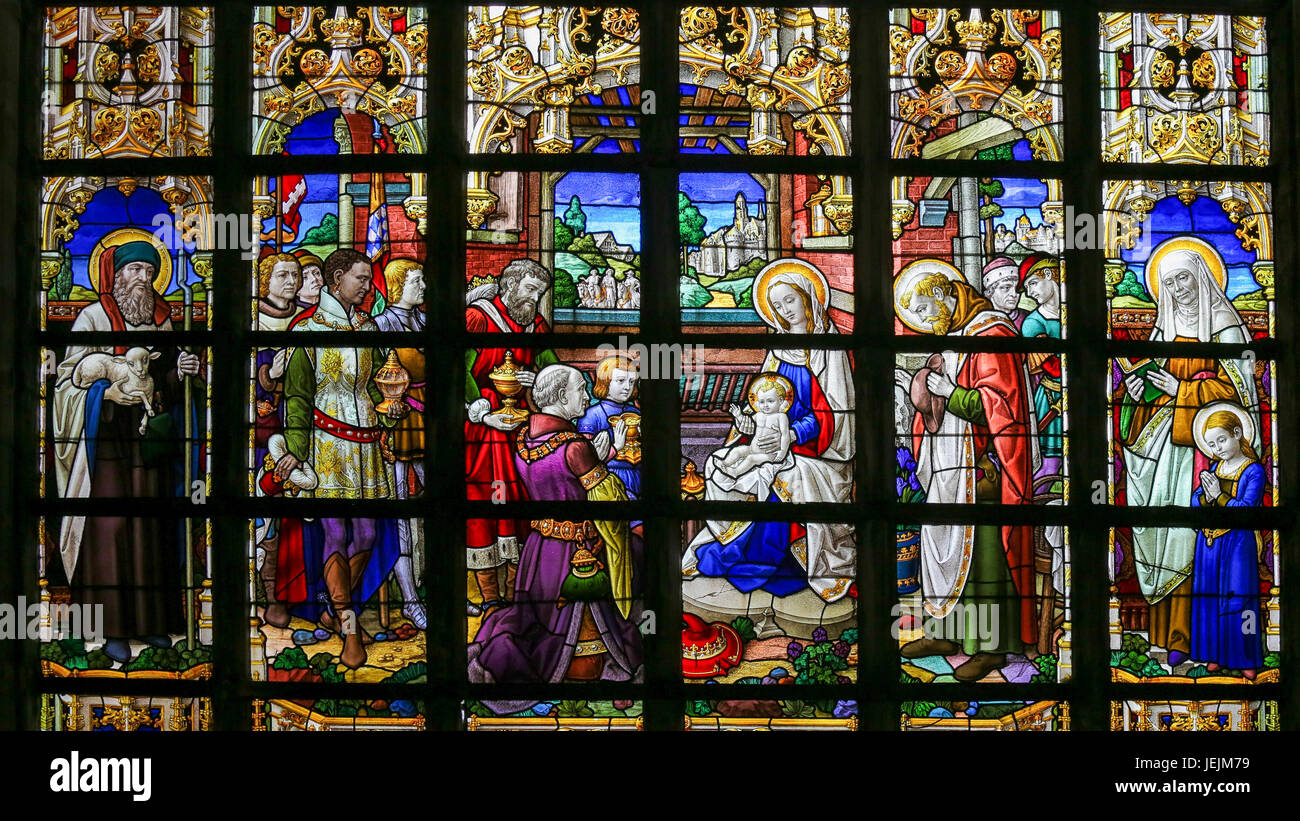 Stained Glass window in St Gummarus Church in Lier, Belgium, depicting an Epiphany Scene, with the Visit of the Three Magi to Bethlehem Stock Photo