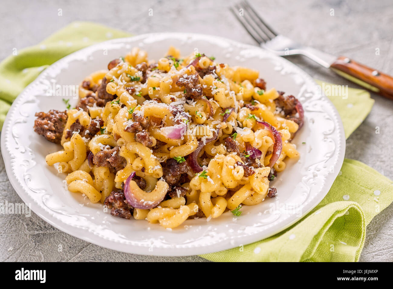 tasty cellentani pasta with meat sauce and onion Stock Photo Alamy