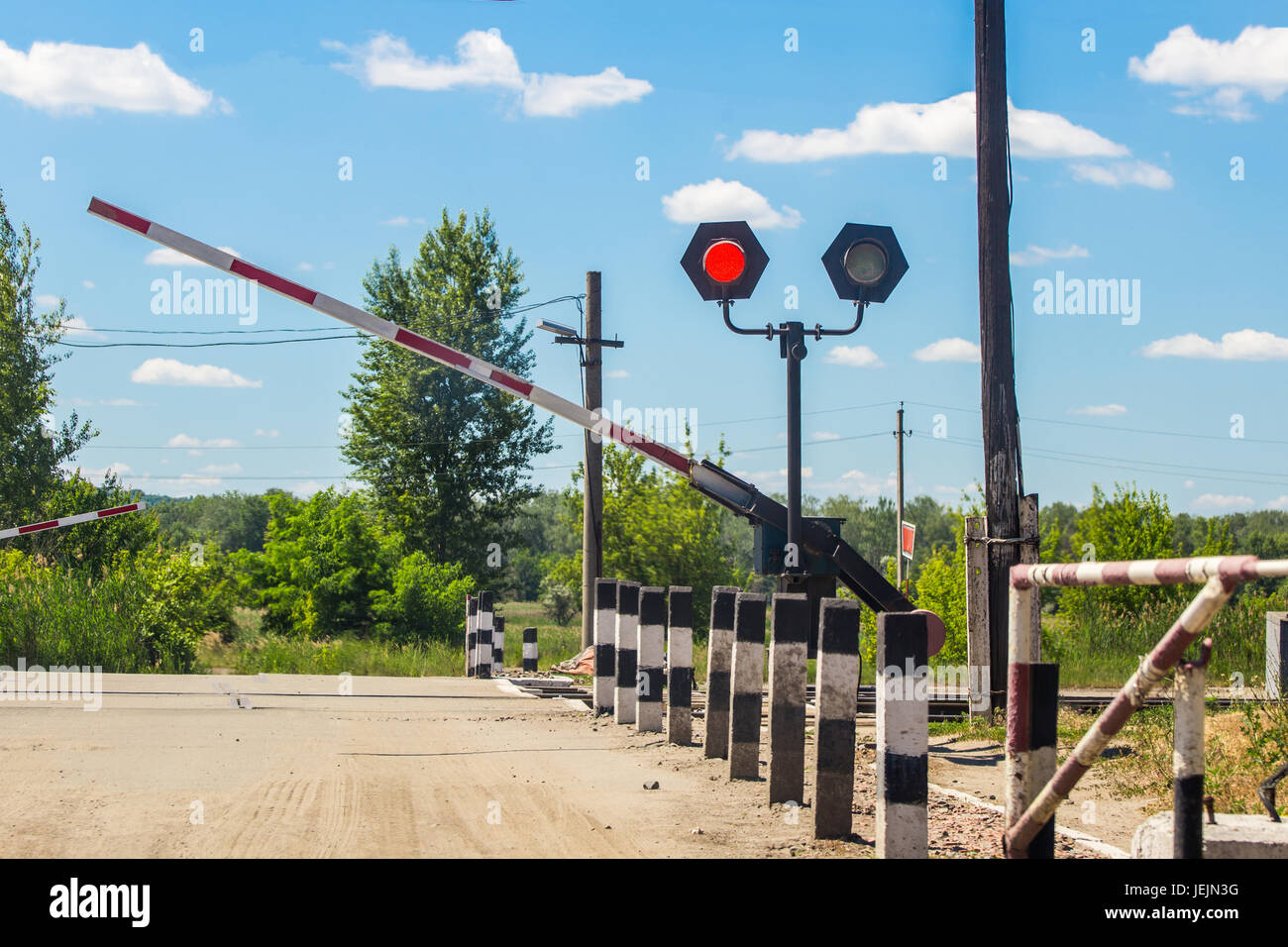 A Closing Barrier And Re Traffic Light At The Railway Crossing Railway Station Stock Photo Alamy